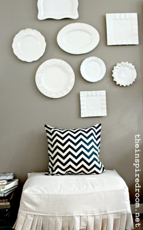 chevron pillow white plates hung on wall