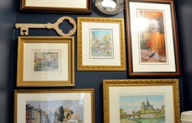 dark-blue-powder-room-with-gallery-wall