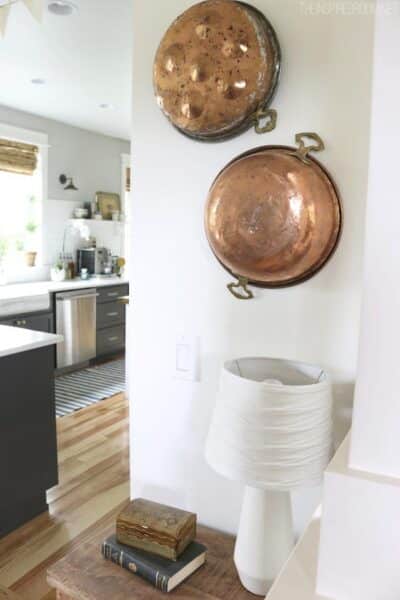 Copper Cookware Hung on the Wall - The Inspired Room