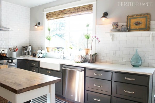 kitchen with grey cabinets and subway tile