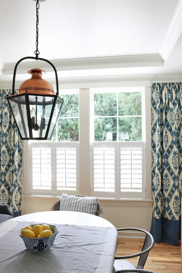 New Plantation Shutters The Inspired Room   The Inspired Room Dining Room Copper Lantern Plantation Shutters And Ikat Curtains 