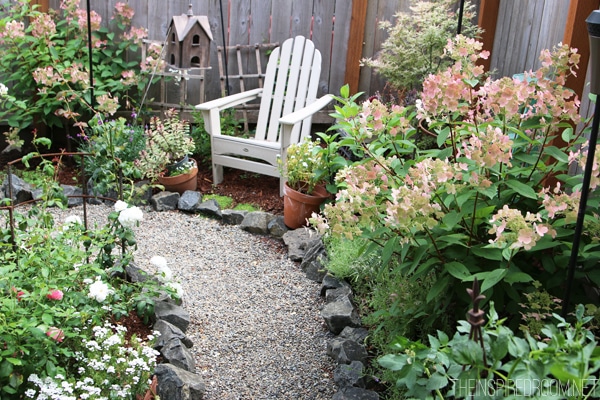 My Backyard Tour {Pea Gravel Patios, Flagstone & Secret Garden}