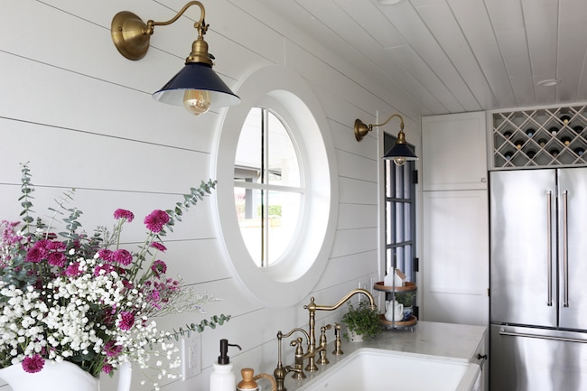 https://theinspiredroom.net/wp-content/uploads/2017/02/Navy-and-Brass-Sconces-The-Inspired-Room-Kitchen-Remodel.jpg