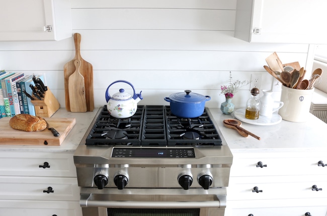 White Shiplap behind Sink and Stove - The Quick Journey