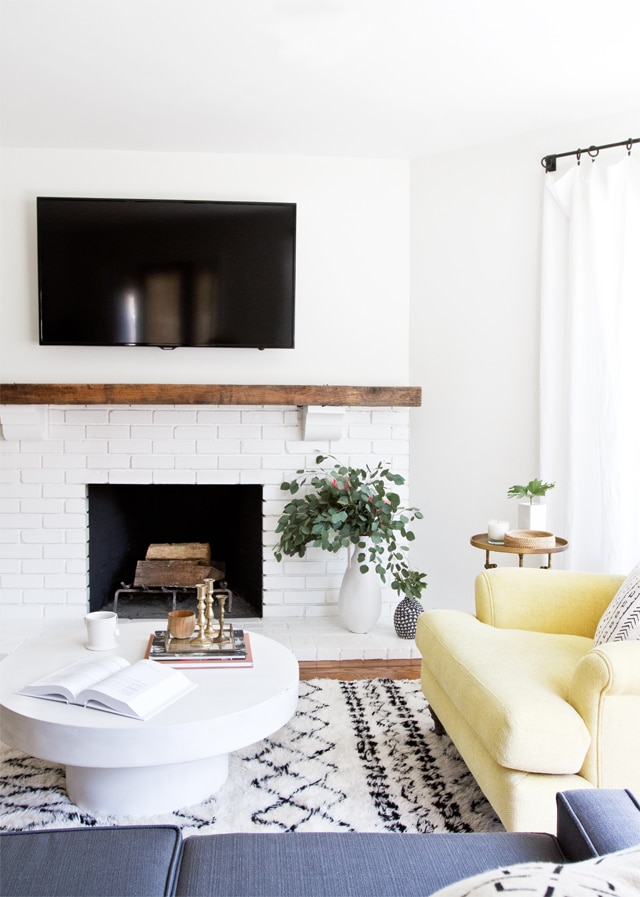 living room with tv and fireplace