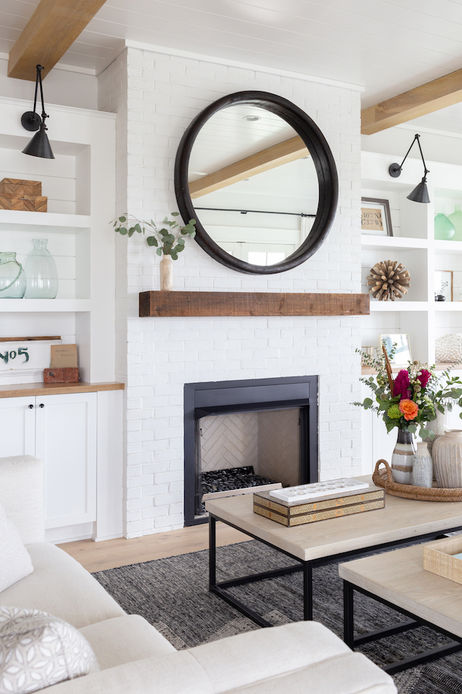 White Fireplace With Wood Mantel And Built Ins 