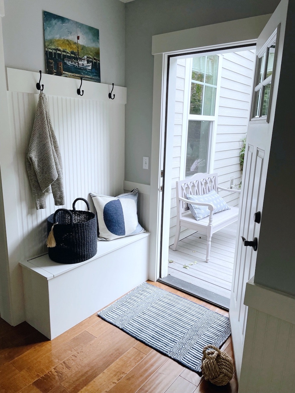 https://theinspiredroom.net/wp-content/uploads/2021/10/the-inspired-room-mudroom-bench-blue-white-decorating-beadboard-1.jpg