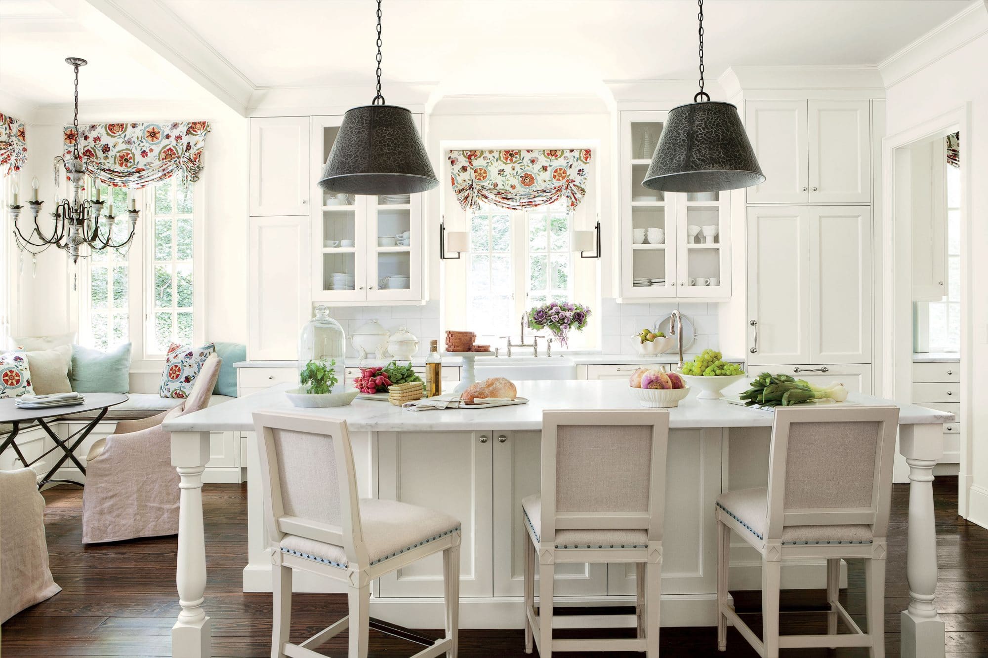 A Classic White Kitchen with Colorful Patterned Roman Shades