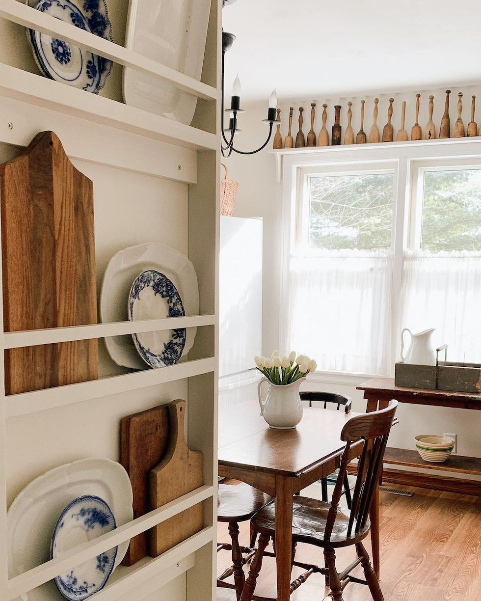 https://theinspiredroom.net/wp-content/uploads/2023/01/plate-rack-platters-wood-boards-kitchen-wall-decorating-cottage-home-charming.jpg