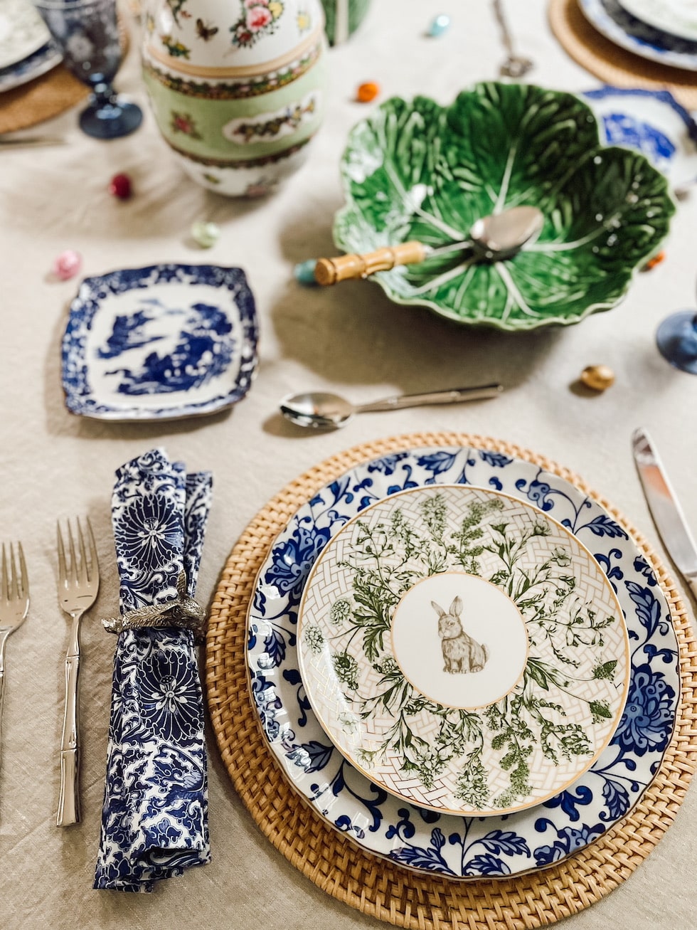 https://theinspiredroom.net/wp-content/uploads/2023/03/easter-tablescape-inspiration-blue-white-rattan-bunny-plates-chinoiserie-rabbit-napkin-rings-the-inspired-room.jpg