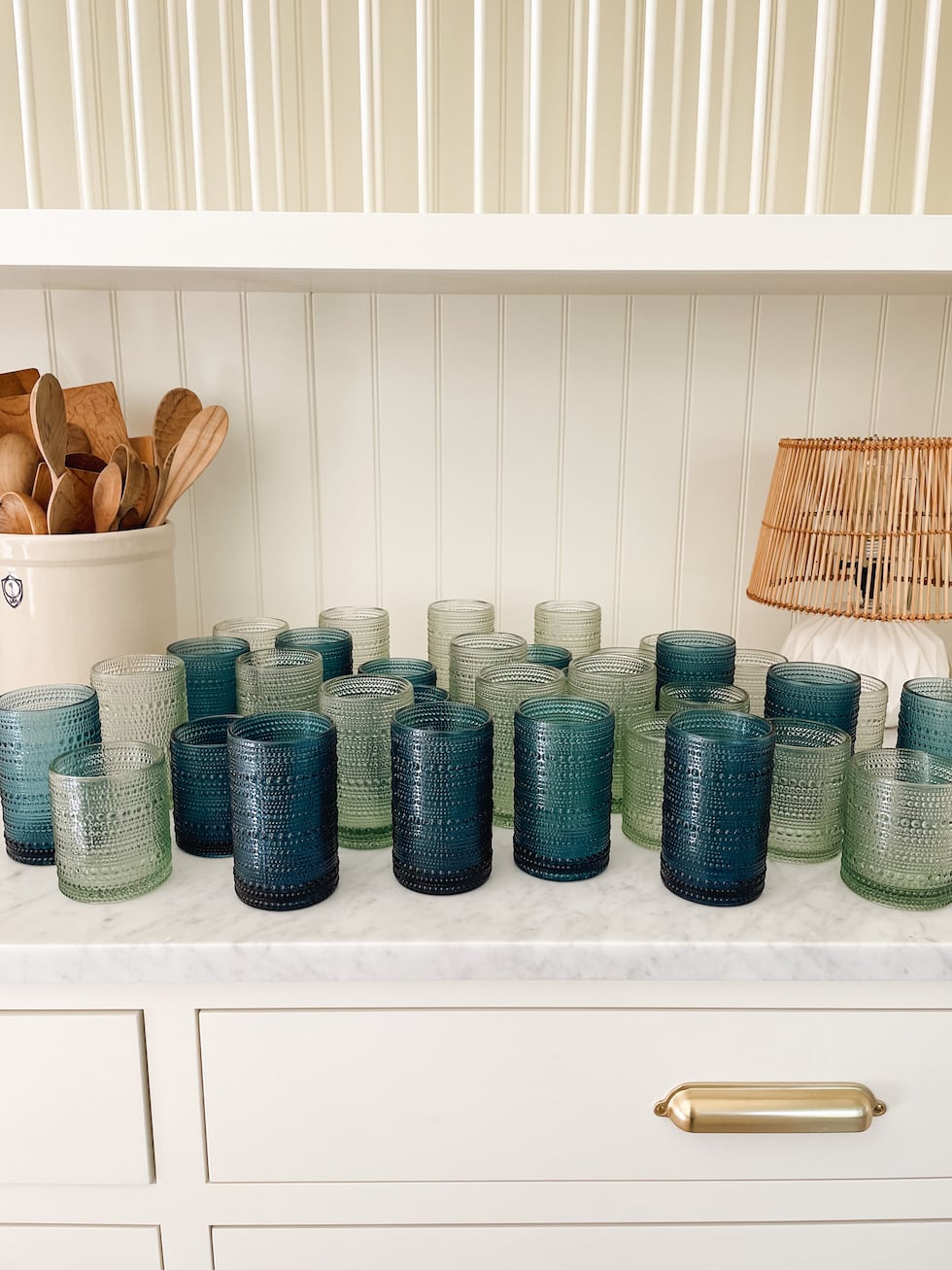 https://theinspiredroom.net/wp-content/uploads/2023/06/green-blue-hobnail-drinking-glasses-kitchen-the-inspired-room-1.jpg