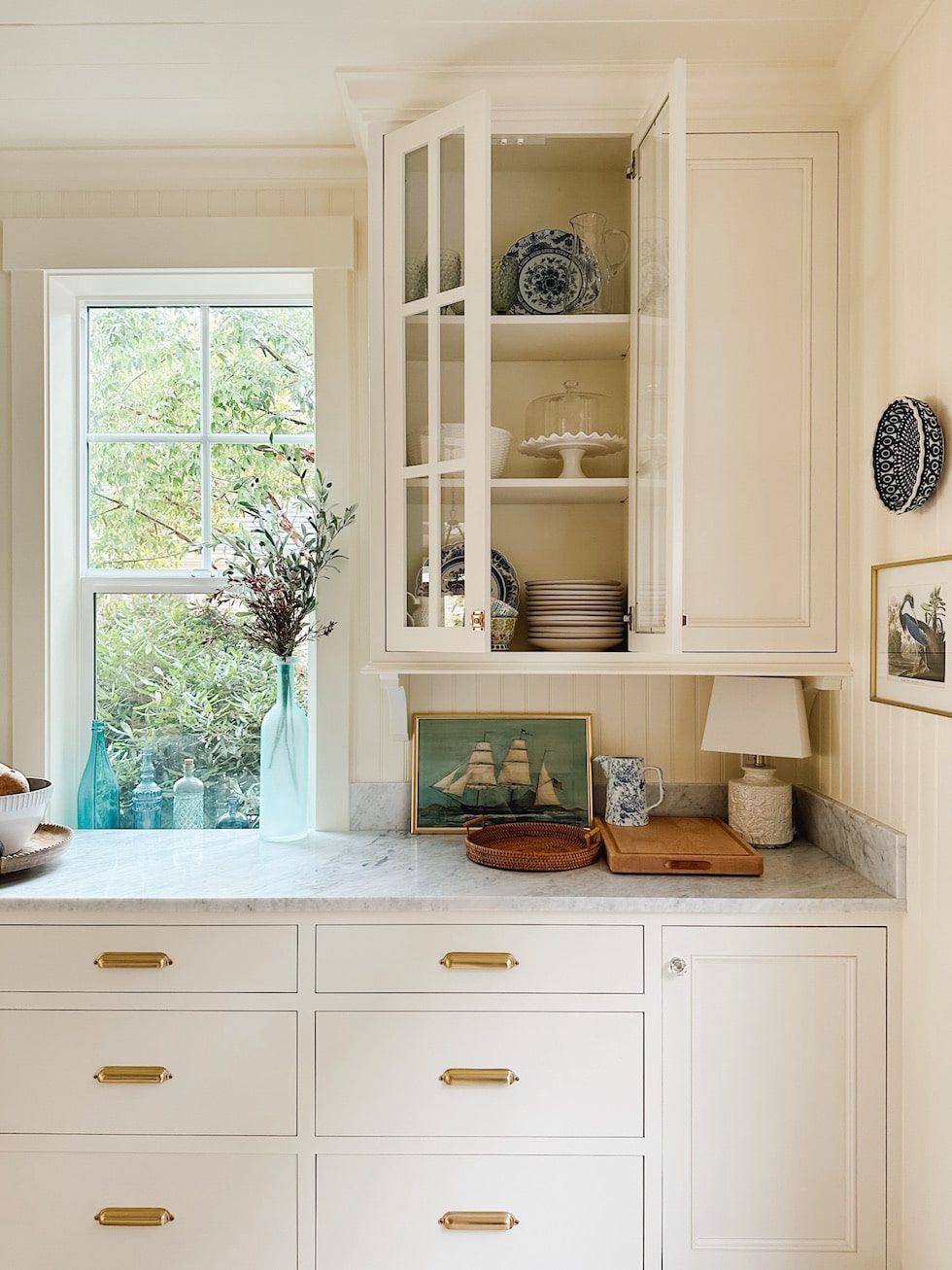 A big reveal...plus a peek at how I'm styling my glass kitchen cabinets!