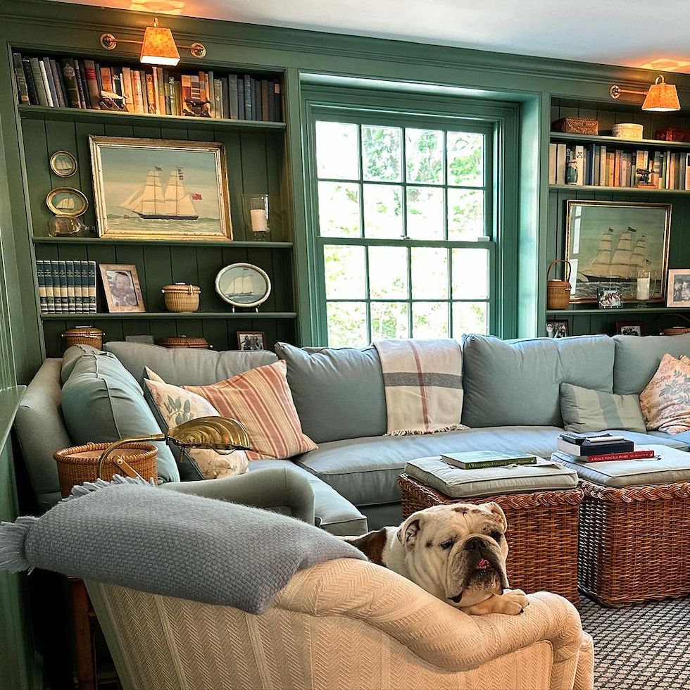 https://theinspiredroom.net/wp-content/uploads/2023/09/cozy-room-green-builtin-bookcases-seascape-art-sectional.jpg