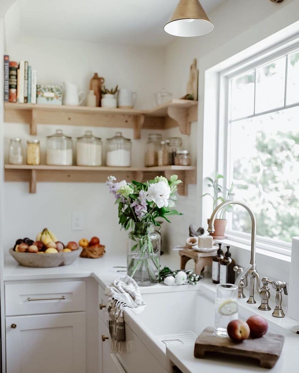 Beautiful Kitchen Sink By Window Open Shelves Glass Jars Brass Sconce 