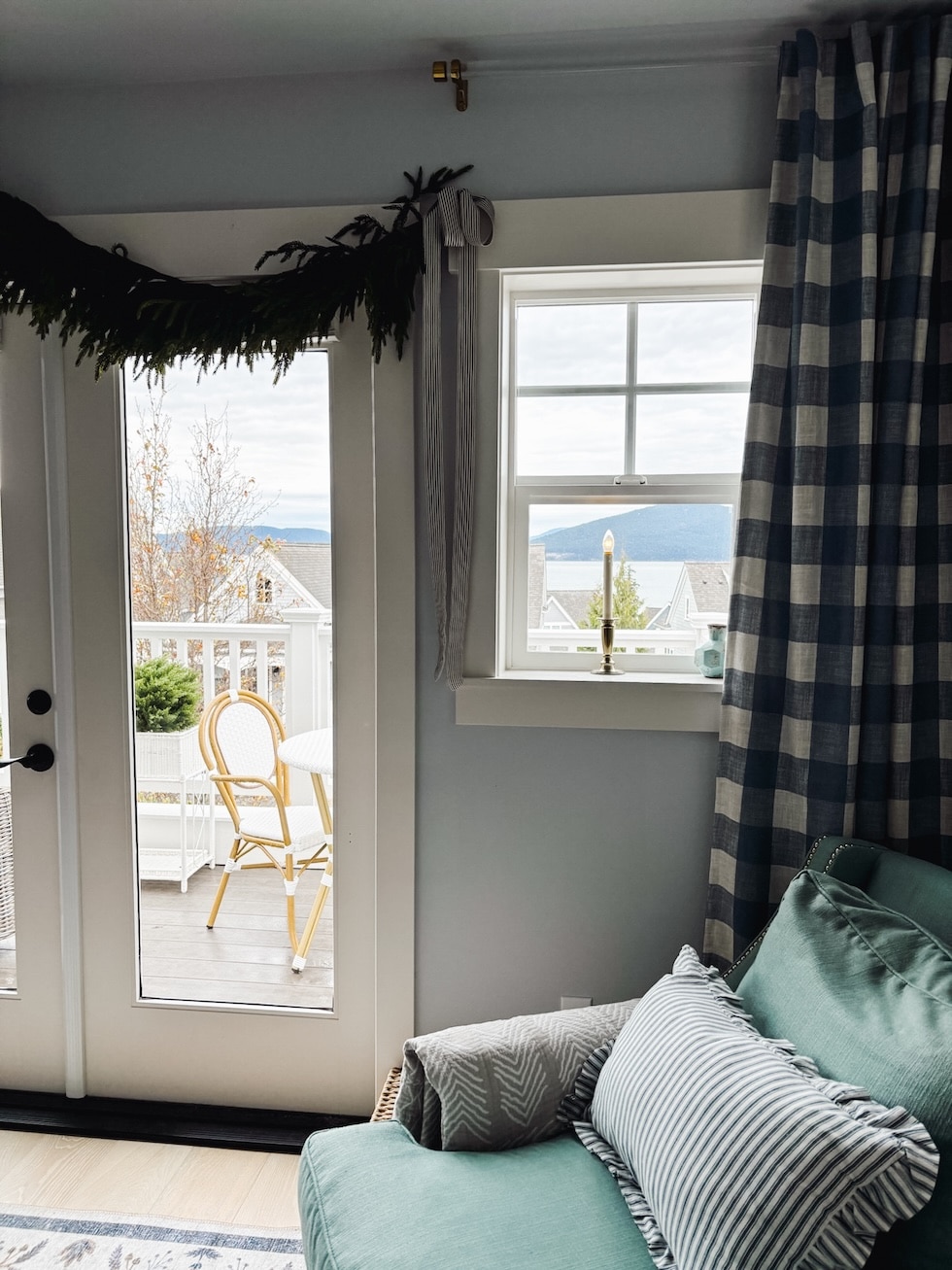 coastal cottage bedroom window candle buffalo check curtains blue white christmas garland french doors the inspired room