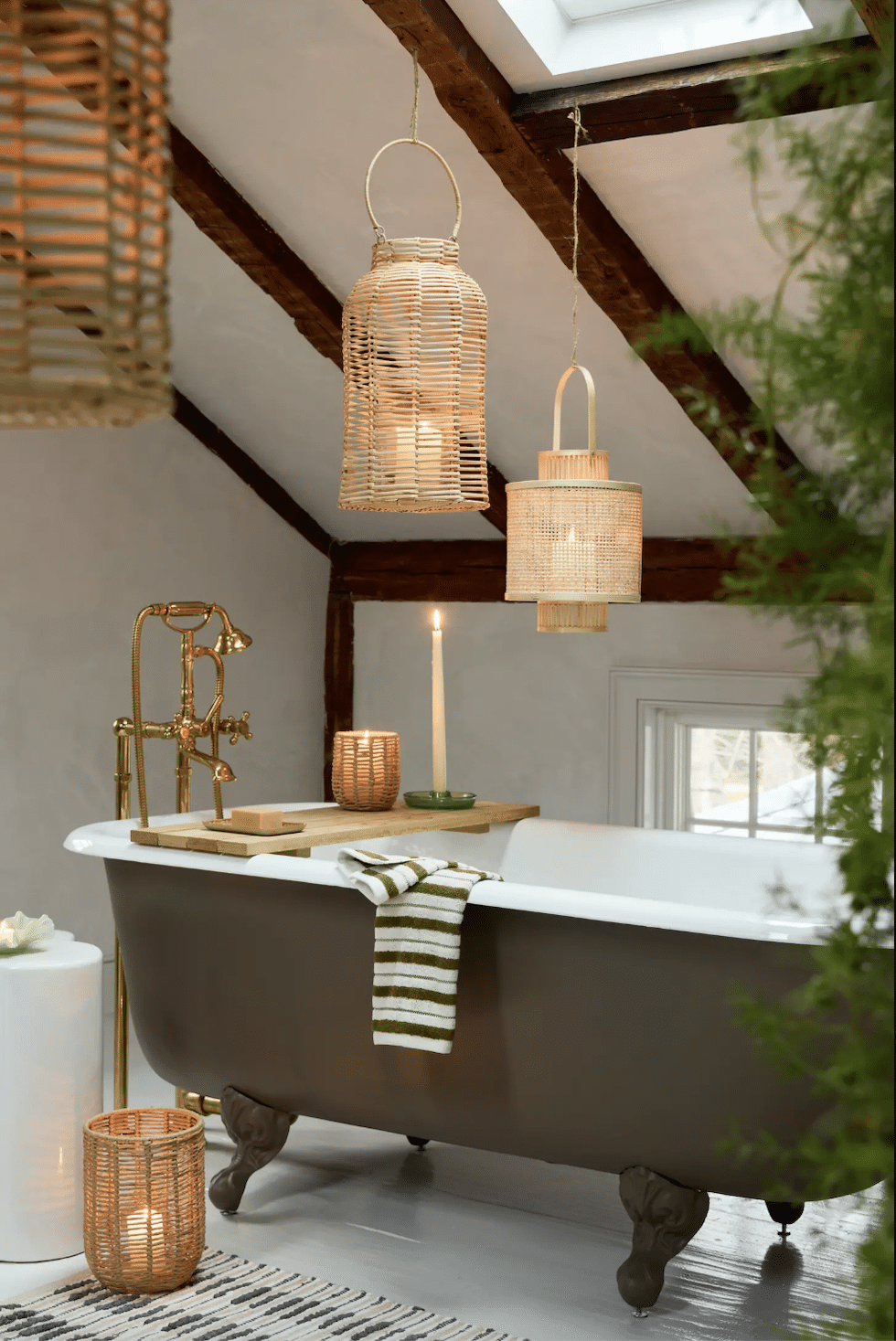 clawfoot tub rattan lanterns hanging over